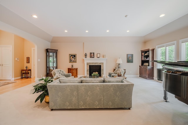 5 Stone Wall Ln, Woodbridge, CT 06525 - living room featuring recessed lighting, light carpet, a fireplace, arched walkways, and baseboards