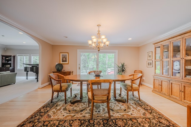 5 Stone Wall Ln, Woodbridge, CT 06525 - dining space with arched walkways, light wood-type flooring, healthy amount of natural light, recessed lighting, and a chandelier