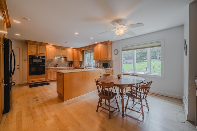 5 Stone Wall Ln, Woodbridge, CT 06525 - kitchen with black appliances, a peninsula, light countertops, light wood-style floors, and recessed lighting