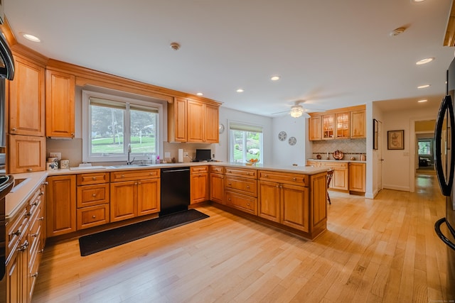 5 Stone Wall Ln, Woodbridge, CT 06525 - kitchen featuring dishwasher, a sink, a peninsula, light wood-style floors, and light countertops