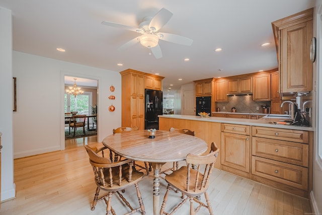 5 Stone Wall Ln, Woodbridge, CT 06525 - kitchen featuring black appliances, light wood-type flooring, a peninsula, decorative backsplash, and recessed lighting