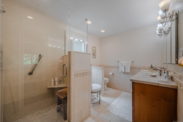 5 Stone Wall Ln, Woodbridge, CT 06525 - full bathroom featuring tile walls, vanity, a shower stall, tile patterned floors, and toilet