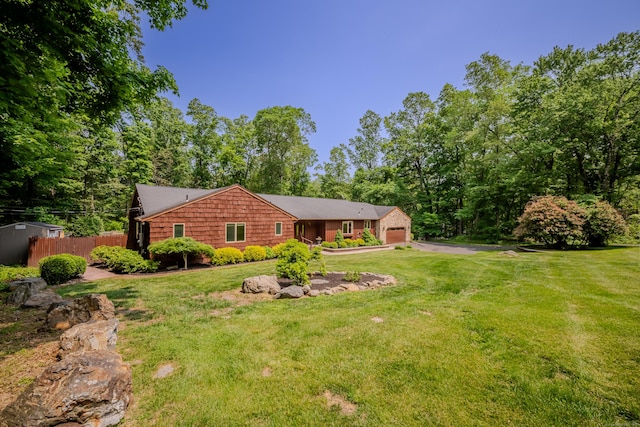 5 Stone Wall Ln, Woodbridge, CT 06525 - view of front facade with an attached garage and driveway