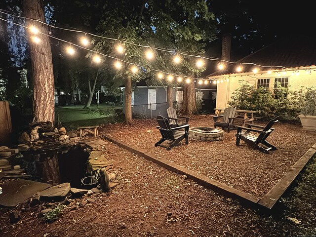 160 Kenyon St, Hartford, CT 06105 - yard at night with a fire pit