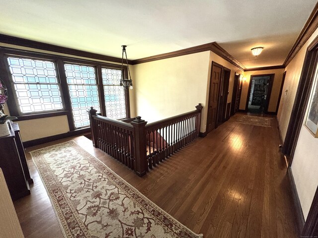 160 Kenyon St, Hartford, CT 06105 - corridor with dark wood finished floors, an upstairs landing, baseboards, and ornamental molding