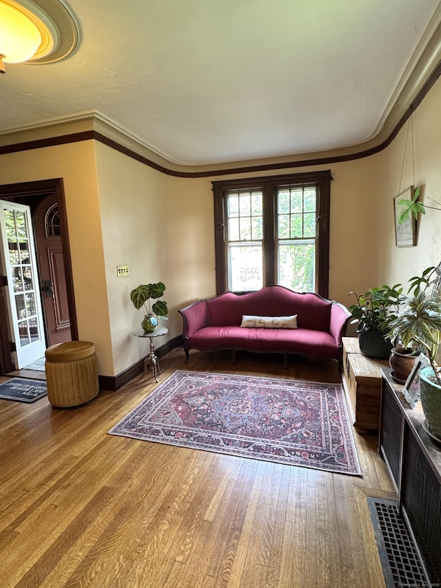 160 Kenyon St, Hartford, CT 06105 - living room with wood finished floors, baseboards, and ornamental molding