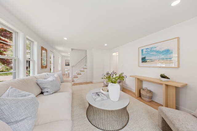 105 Blake Dr, Fairfield, CT 06824 - living area with wood finished floors, stairway, recessed lighting, and baseboards
