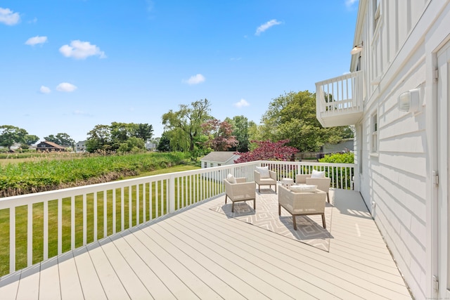 105 Blake Dr, Fairfield, CT 06824 - wooden terrace featuring a lawn, an outdoor hangout area, and an outbuilding