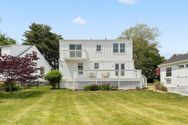 105 Blake Dr, Fairfield, CT 06824 - back of property featuring board and batten siding, a lawn, and a wooden deck