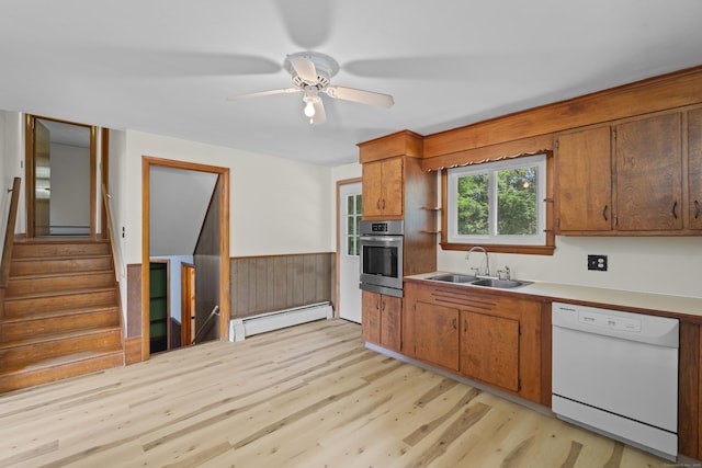 26 Caroldon Rd, Middletown, CT 06457 - kitchen featuring dishwasher, oven, baseboard heating, light wood finished floors, and wainscoting