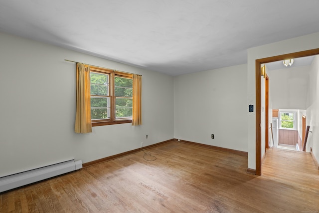 26 Caroldon Rd, Middletown, CT 06457 - spare room with a baseboard heating unit, healthy amount of natural light, and wood finished floors