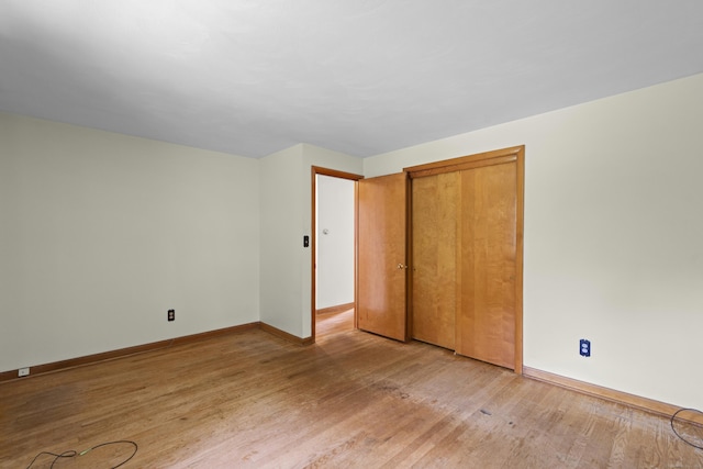 26 Caroldon Rd, Middletown, CT 06457 - unfurnished bedroom with light wood-type flooring and a closet