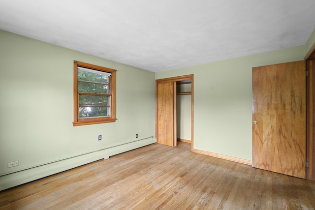 26 Caroldon Rd, Middletown, CT 06457 - unfurnished bedroom with baseboard heating and wood finished floors