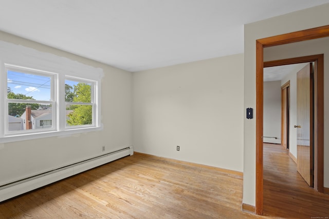 26 Caroldon Rd, Middletown, CT 06457 - empty room with a baseboard radiator and light wood-style flooring