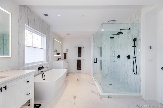4 Vona Way, Newtown, CT 06470 - bathroom featuring vanity, a stall shower, a freestanding bath, marble finish flooring, and recessed lighting
