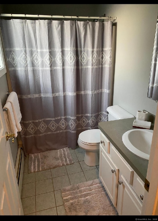 29 Meadowbrook Dr, Brooklyn, CT 06234 - full bathroom with a baseboard heating unit, vanity, tile patterned flooring, toilet, and a shower with curtain