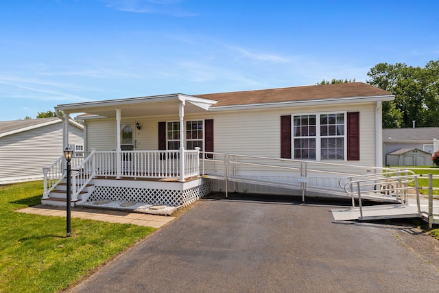 7 Rose Ct, East Windsor, CT 06088 - view of front facade featuring a porch and a shingled roof