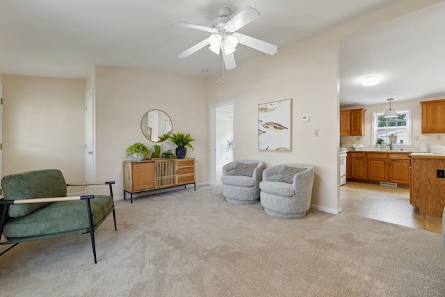7 Rose Ct, East Windsor, CT 06088 - living room featuring light colored carpet, a ceiling fan, and baseboards