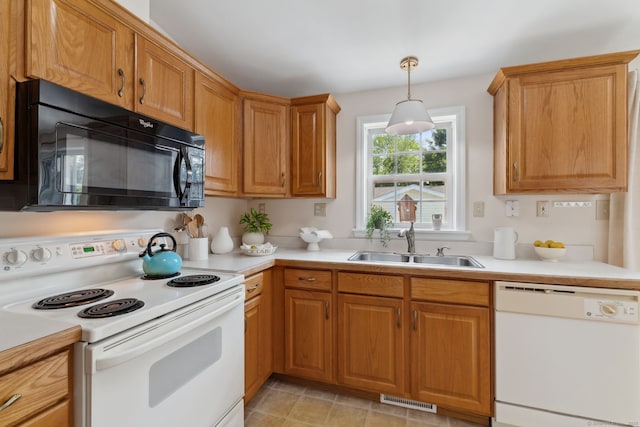 7 Rose Ct, East Windsor, CT 06088 - kitchen featuring white appliances, a sink, light countertops, decorative light fixtures, and brown cabinets