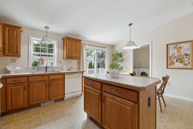 7 Rose Ct, East Windsor, CT 06088 - kitchen featuring white dishwasher, washing machine and clothes dryer, a sink, and healthy amount of natural light