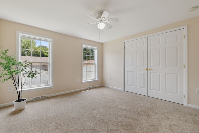 7 Rose Ct, East Windsor, CT 06088 - unfurnished bedroom featuring carpet flooring, baseboards, a closet, and a ceiling fan