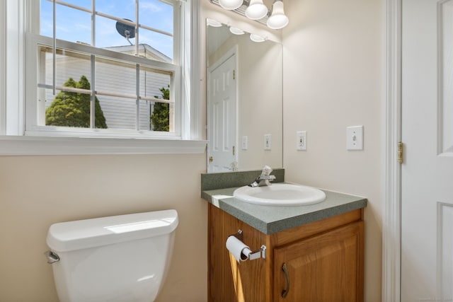 7 Rose Ct, East Windsor, CT 06088 - bathroom with vanity, toilet, and plenty of natural light