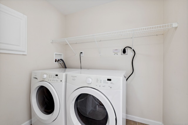 7 Rose Ct, East Windsor, CT 06088 - laundry area with washing machine and dryer and baseboards
