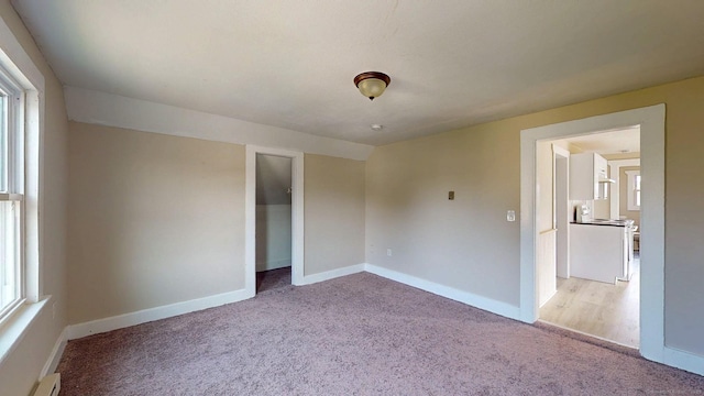 24 N St, Meriden, CT 06451 - unfurnished bedroom with carpet floors, baseboards, and a baseboard heating unit