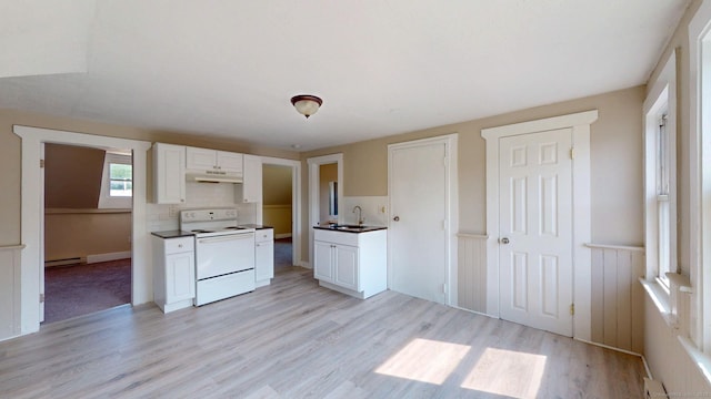 24 N St, Meriden, CT 06451 - kitchen with white electric stove, under cabinet range hood, a sink, a baseboard heating unit, and light wood finished floors