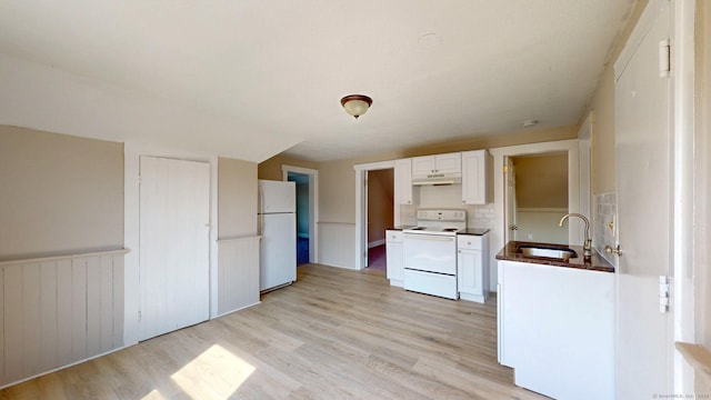 24 N St, Meriden, CT 06451 - kitchen with white appliances, a sink, light wood-type flooring, white cabinets, and a wainscoted wall