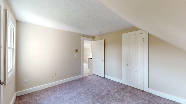 24 N St, Meriden, CT 06451 - unfurnished bedroom featuring carpet, baseboards, and a textured ceiling