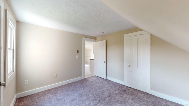 24 N St, Meriden, CT 06451 - unfurnished bedroom featuring carpet floors, baseboards, and a textured ceiling