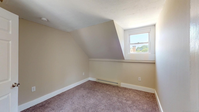 24 N St, Meriden, CT 06451 - additional living space with baseboard heating, carpet flooring, vaulted ceiling, and baseboards