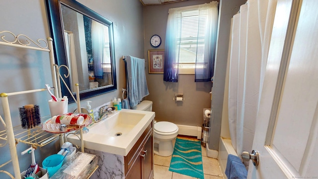 24 N St, Meriden, CT 06451 - bathroom featuring plenty of natural light, toilet, vanity, and a baseboard heating unit