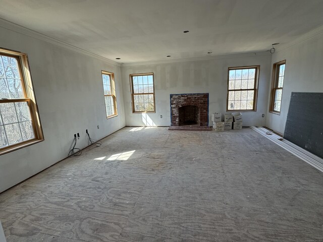 501 Taylor Hill Rd, Griswold, CT 06351 - unfurnished living room with crown molding, healthy amount of natural light, a fireplace, and carpet