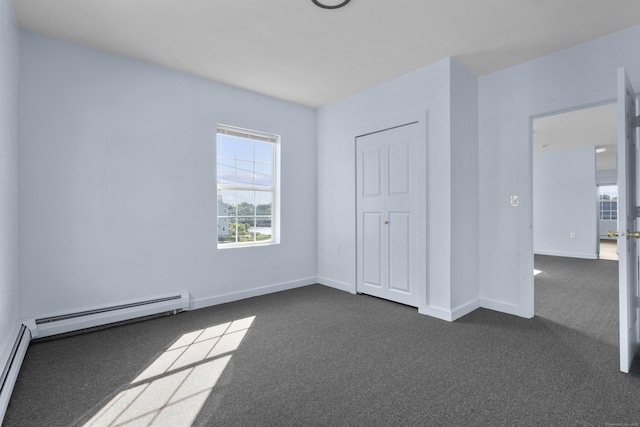 728 Quinnipiac Ave, New Haven, CT 06513 - unfurnished bedroom with dark colored carpet, multiple windows, baseboards, and a baseboard radiator