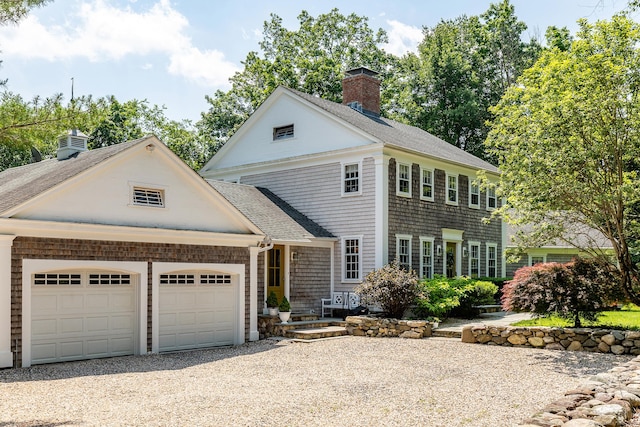 59 Davids Hill Rd, Woodbury, CT 06798 - view of front of house with a chimney, gravel driveway, roof with shingles, and a garage