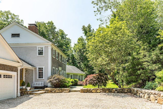 59 Davids Hill Rd, Woodbury, CT 06798 - view of side of property featuring a chimney and roof with shingles