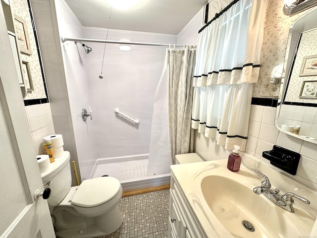 11 Abbe Rd, East Windsor, CT 06088 - full bath with tile walls, a shower stall, vanity, crown molding, and tile patterned flooring