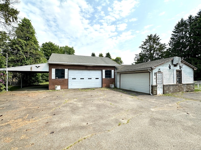 11 Abbe Rd, East Windsor, CT 06088 - view of front of house featuring brick siding and a detached garage