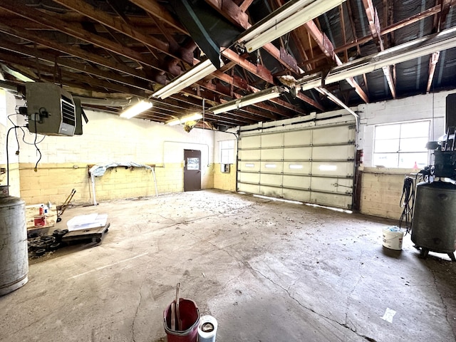 11 Abbe Rd, East Windsor, CT 06088 - garage featuring a heating unit and concrete block wall