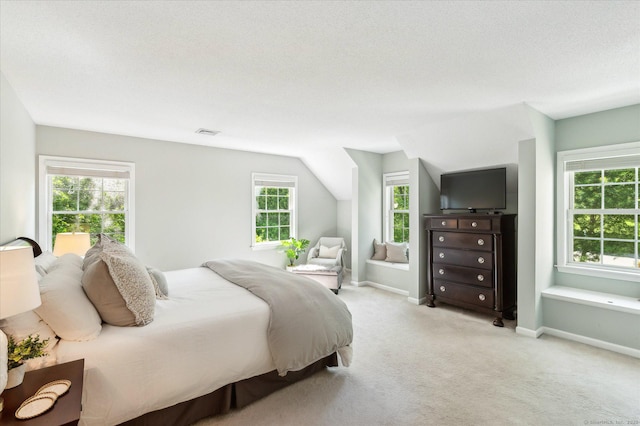 4 Joseph Dr Unit 4, Simsbury, CT 06070 - bedroom featuring multiple windows, light carpet, and baseboards