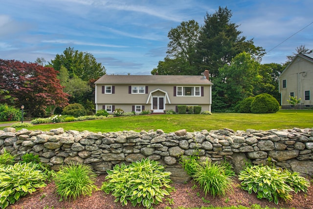 134 Walnut St, Monroe, CT 06468 - bi-level home with a chimney and a front yard