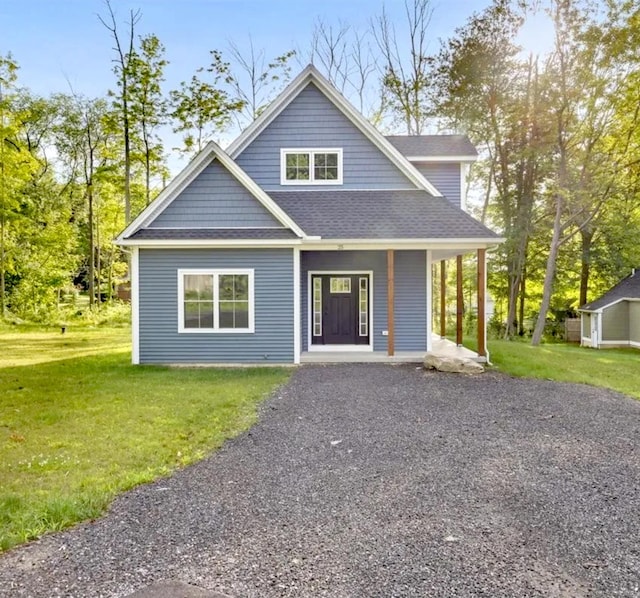25 Ross Ave, Coventry, CT 06238 - view of front of property featuring roof with shingles, a front yard, and a porch