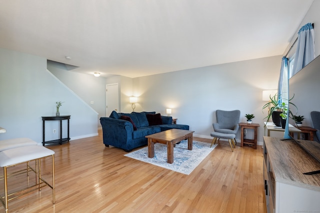 66 Staffordshire Commons Dr Unit 66, Wallingford, CT 06492 - living room with light wood finished floors, baseboards, and stairs