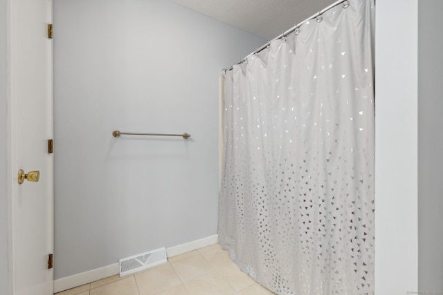 66 Staffordshire Commons Dr Unit 66, Wallingford, CT 06492 - full bathroom with baseboards, tile patterned floors, a shower with shower curtain, and a textured ceiling