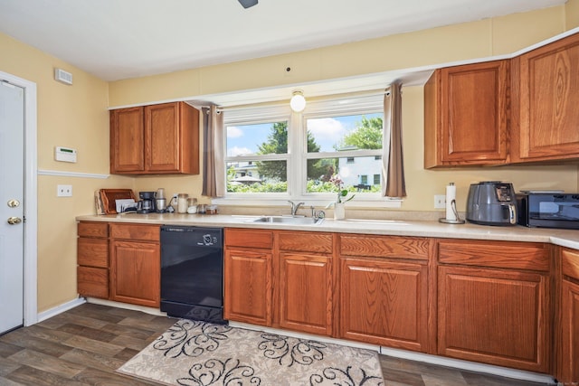 69 Ponham St, Waterbury, CT 06708 - kitchen with black appliances, light countertops, dark wood finished floors, brown cabinets, and a sink