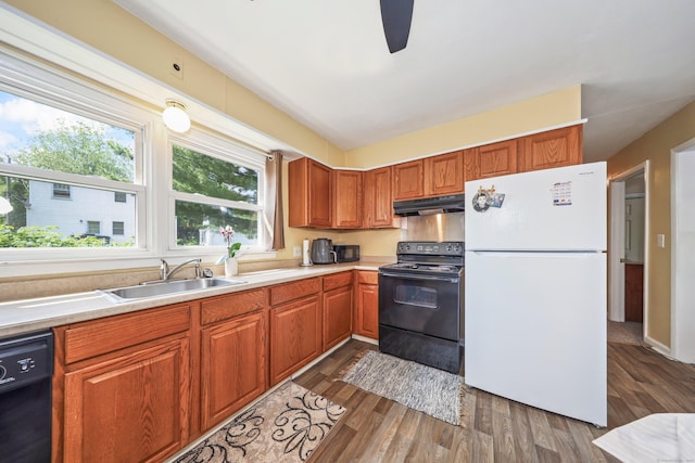 69 Ponham St, Waterbury, CT 06708 - kitchen featuring black appliances, under cabinet range hood, a sink, and healthy amount of natural light