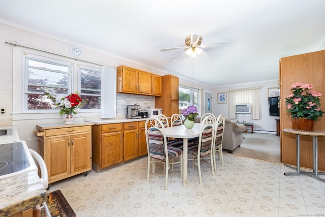 dining room with light flooring, a ceiling fan, crown molding, and cooling unit