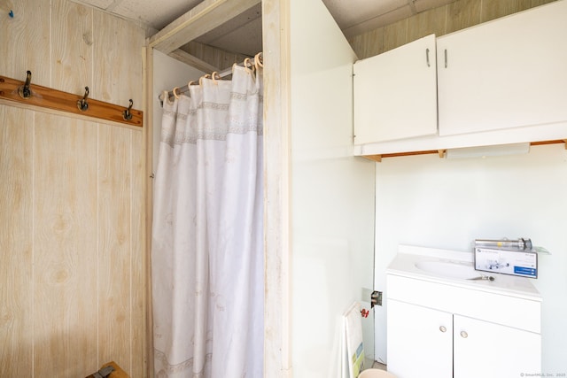 full bathroom featuring vanity and curtained shower